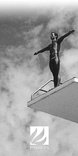Man at the top of a diving board.